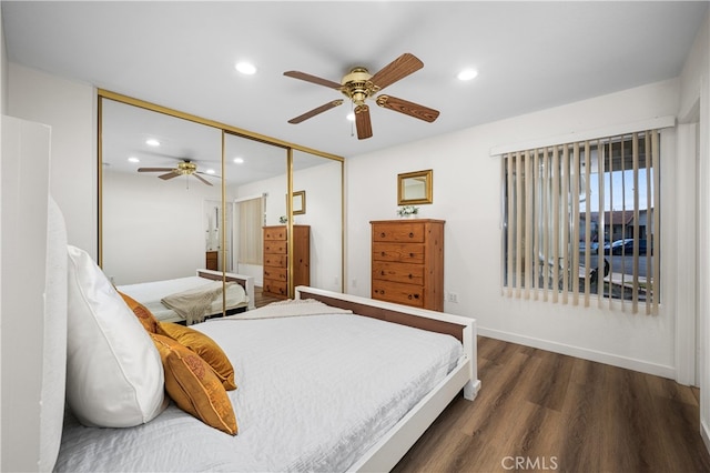 bedroom with baseboards, ceiling fan, wood finished floors, a closet, and recessed lighting