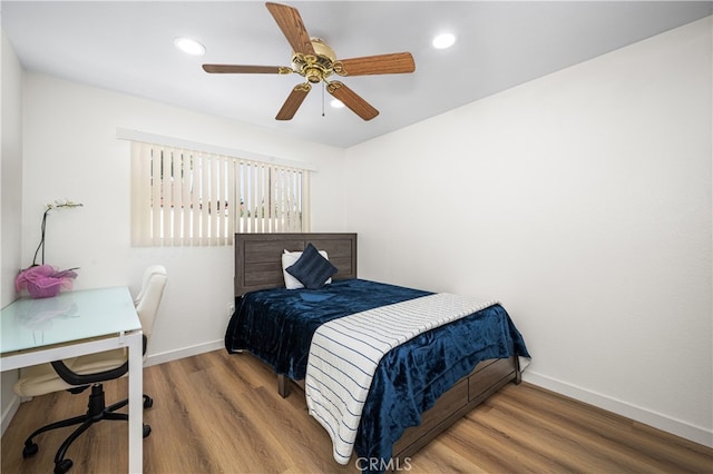 bedroom featuring recessed lighting, wood finished floors, a ceiling fan, and baseboards