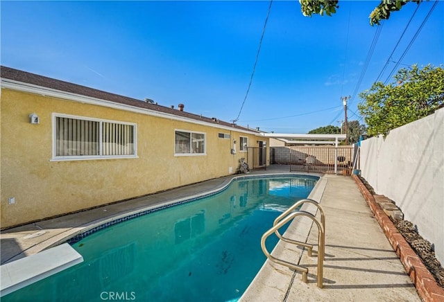 view of pool featuring a patio area, a fenced backyard, and a fenced in pool