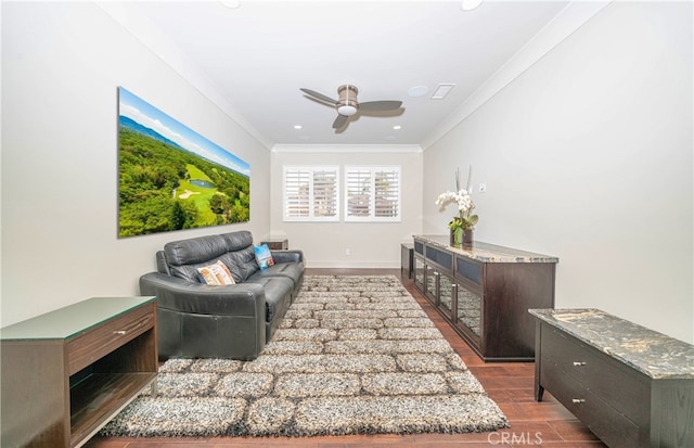 living area featuring a ceiling fan, recessed lighting, crown molding, and baseboards