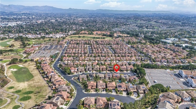 birds eye view of property with view of golf course, a residential view, and a mountain view