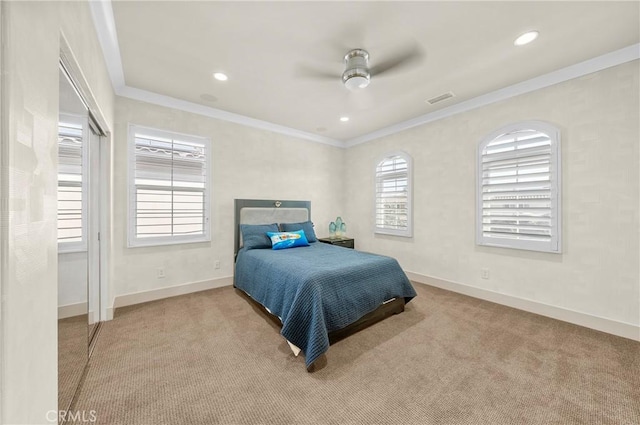 bedroom featuring light colored carpet, crown molding, visible vents, and baseboards