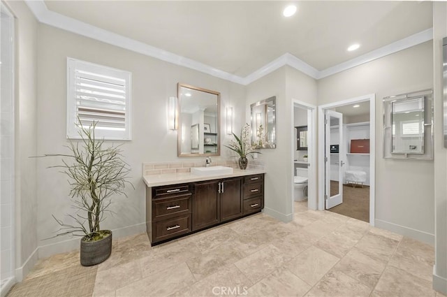 full bath with toilet, recessed lighting, vanity, baseboards, and ornamental molding