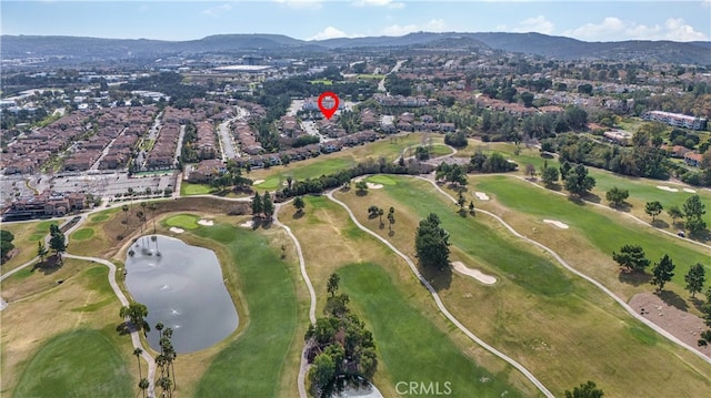 birds eye view of property featuring view of golf course and a water and mountain view