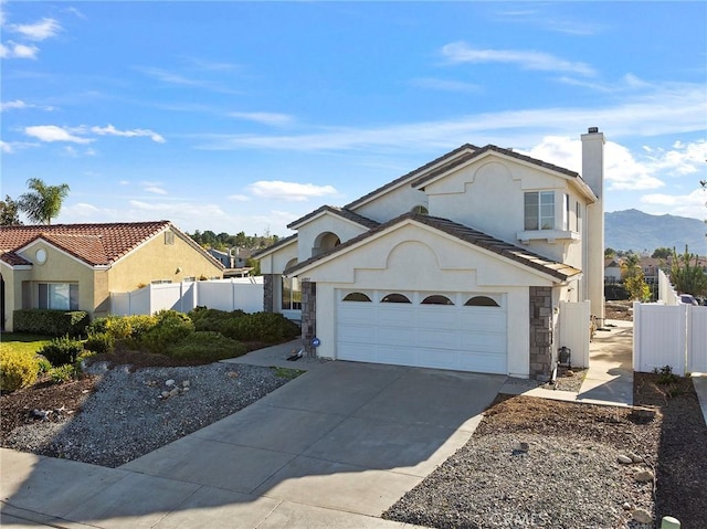 view of front of house with a chimney, stucco siding, concrete driveway, fence, and a garage