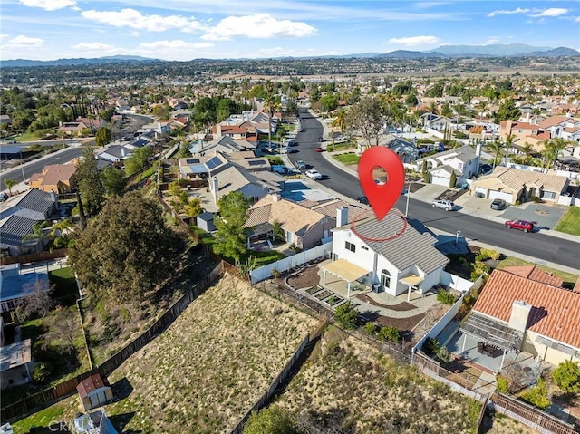 birds eye view of property with a residential view and a mountain view