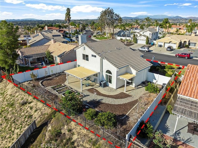 bird's eye view with a residential view and a mountain view