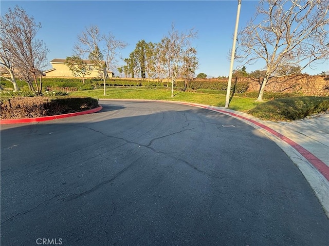 view of street featuring curbs