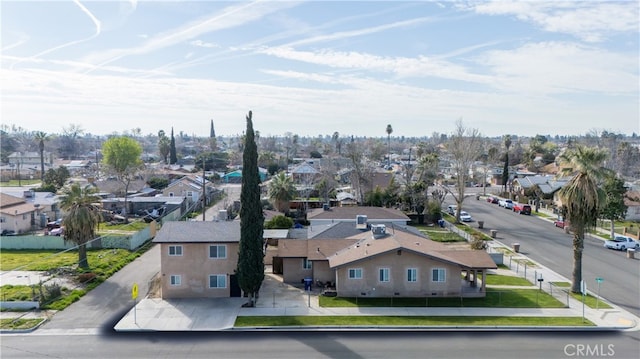 birds eye view of property with a residential view