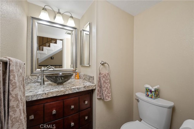 half bath with vanity and toilet