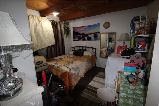 bedroom featuring beamed ceiling and wooden ceiling