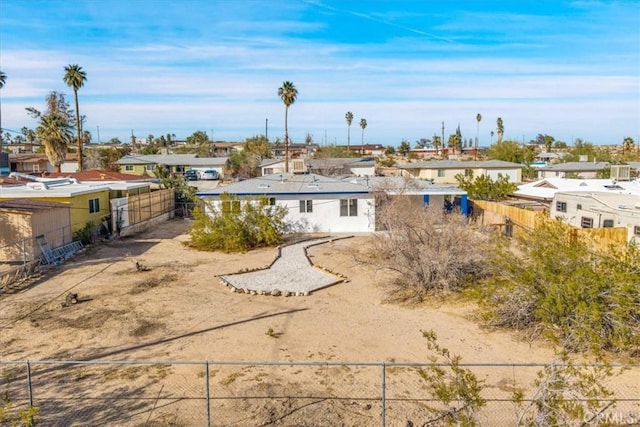 rear view of property with fence