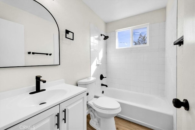 full bathroom with toilet, shower / tub combination, wood finished floors, and vanity