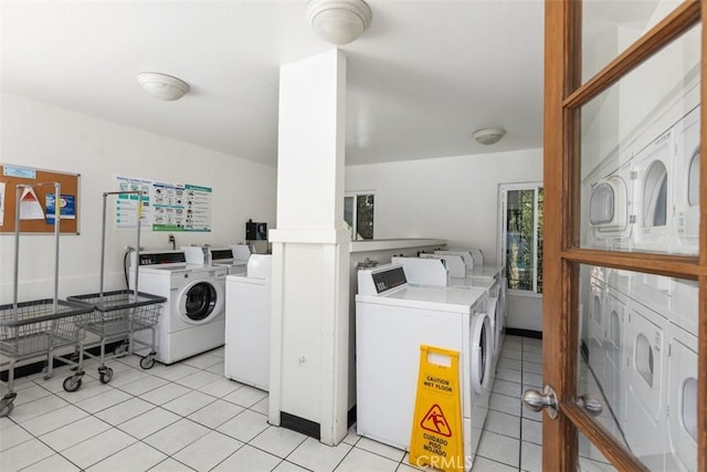 7506 Parkway Dr Unit 104, La Mesa, CA 91942 - shared laundry room with independent washer and dryer and light tile patterned floors