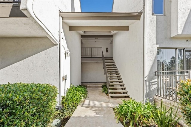 property entrance featuring stucco siding