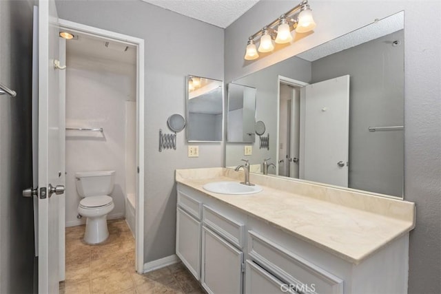 full bath with shower / bath combination, baseboards, toilet, tile patterned floors, and vanity