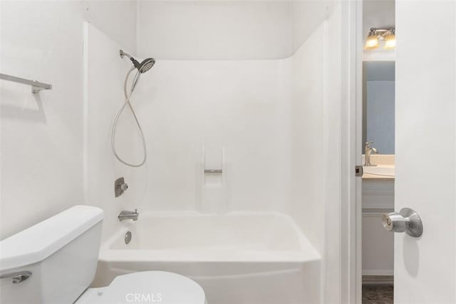 full bath featuring toilet, vanity, and bathing tub / shower combination