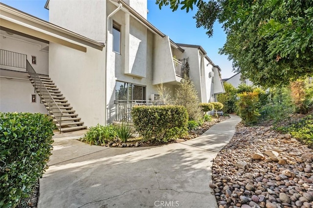 7506 Parkway Dr Unit 104, La Mesa, CA 91942 - exterior space featuring stairs and stucco siding