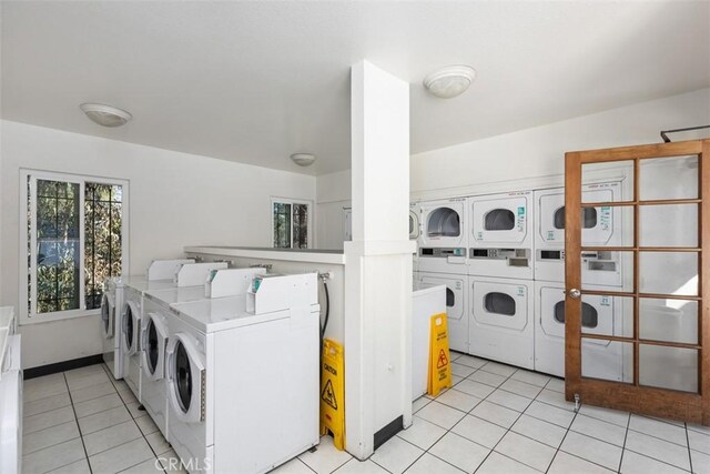 7506 Parkway Dr Unit 104, La Mesa, CA 91942 - community laundry room with washing machine and dryer, stacked washing machine and dryer, and light tile patterned flooring