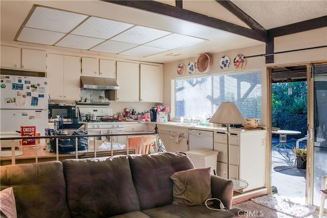 kitchen featuring white appliances, light countertops, under cabinet range hood, white cabinetry, and a sink