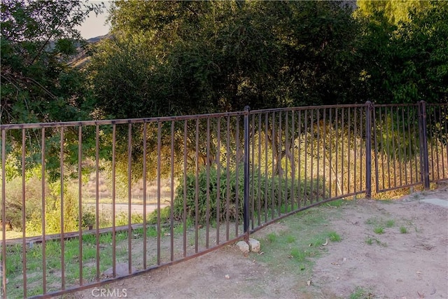 view of gate featuring fence