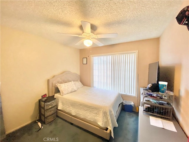 bedroom with carpet floors, a textured ceiling, and a ceiling fan