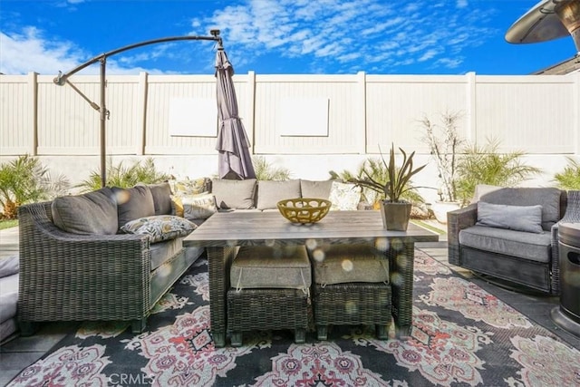 view of patio / terrace with a fenced backyard and an outdoor living space