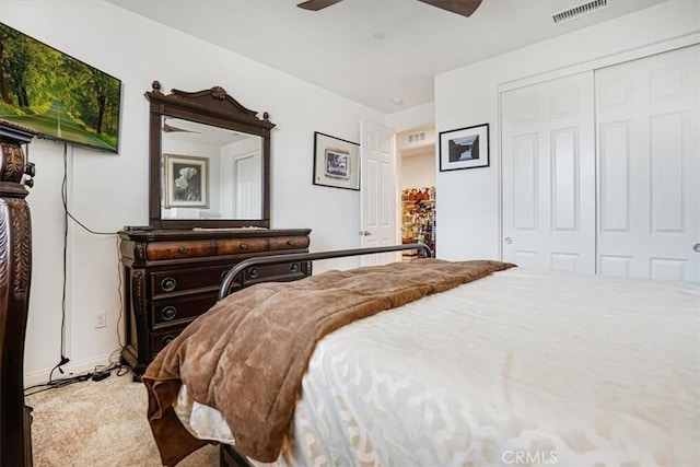 bedroom featuring a closet, visible vents, and ceiling fan