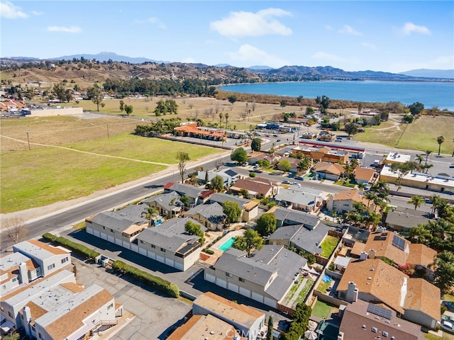 aerial view featuring a water and mountain view