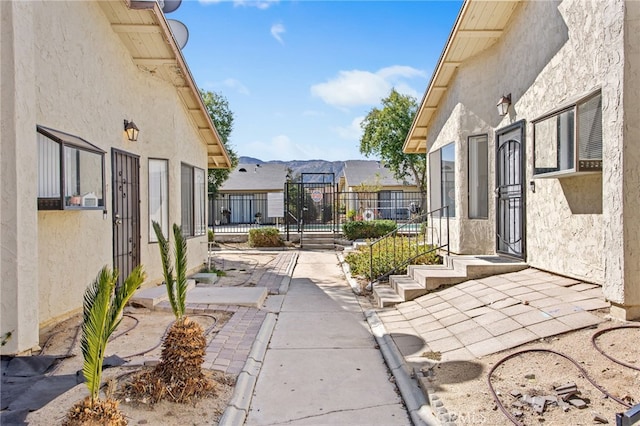 view of patio featuring fence and a mountain view