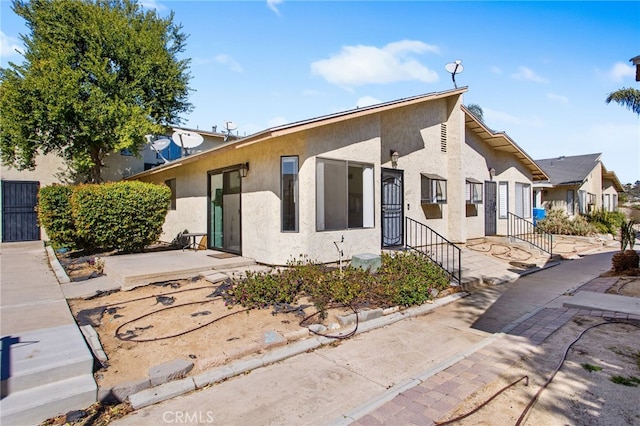 view of front of home featuring stucco siding