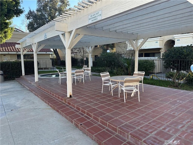 view of patio / terrace featuring outdoor dining area, fence, and a pergola