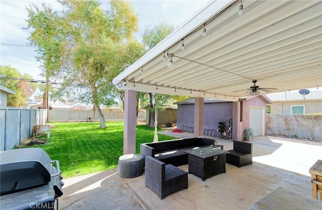 view of patio featuring a fenced backyard, ceiling fan, outdoor lounge area, and an outdoor structure