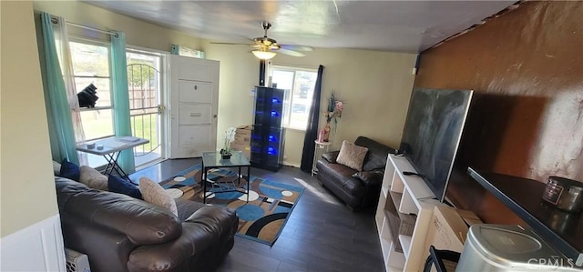 living room featuring a ceiling fan and wood finished floors