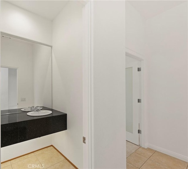 bathroom with tile patterned flooring and a sink