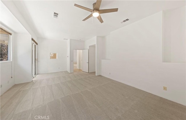 interior space featuring light carpet, visible vents, and a ceiling fan