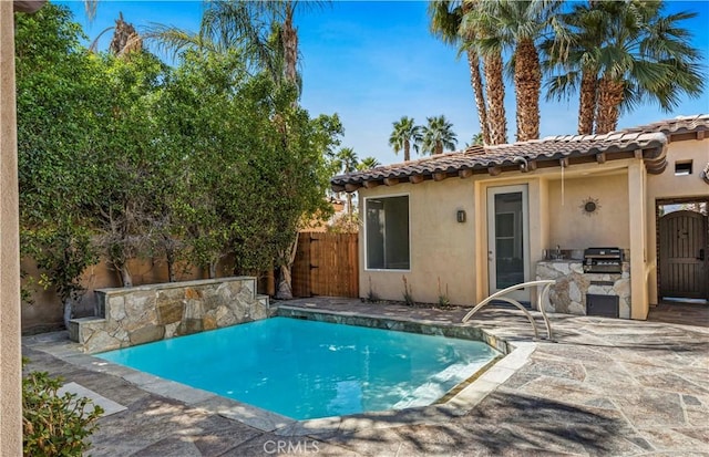 view of pool with a fenced in pool, a gate, a patio area, a grill, and fence