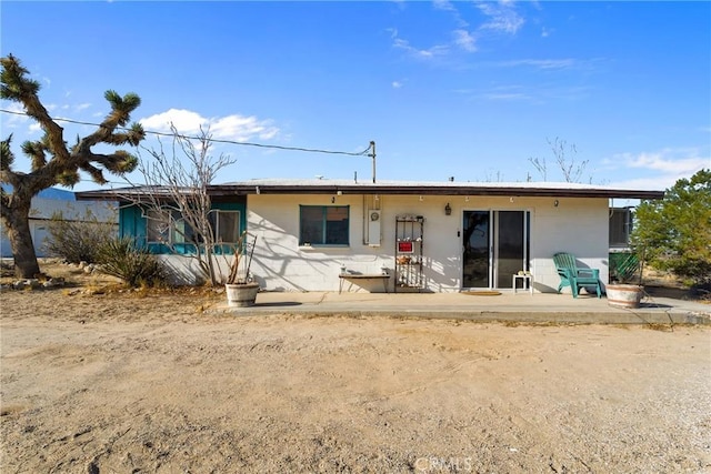 back of house with a patio area