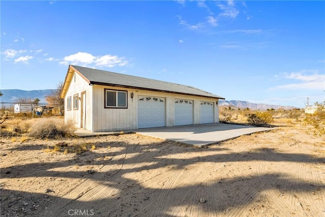 detached garage with a mountain view