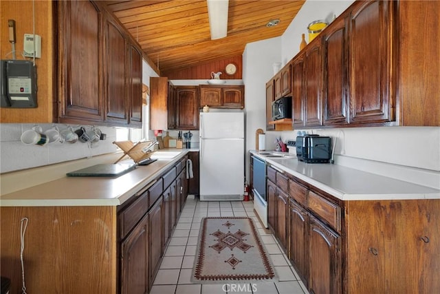 kitchen featuring light countertops, wooden ceiling, light tile patterned flooring, vaulted ceiling, and white appliances