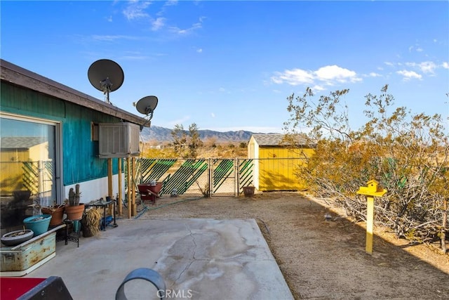 view of patio / terrace with a fenced backyard and a mountain view