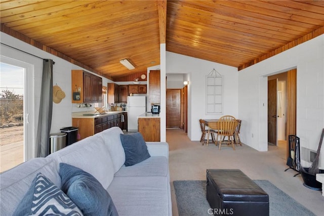 living area featuring vaulted ceiling, wooden ceiling, and light colored carpet