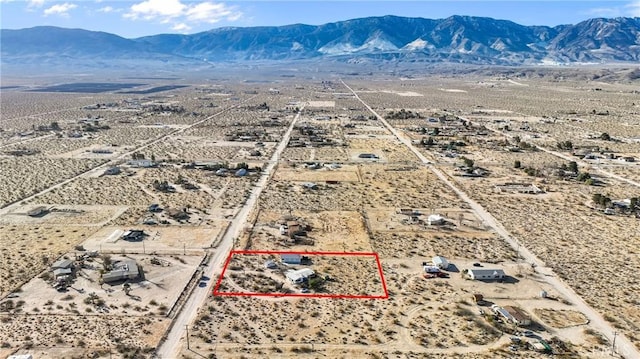 bird's eye view featuring view of desert and a mountain view