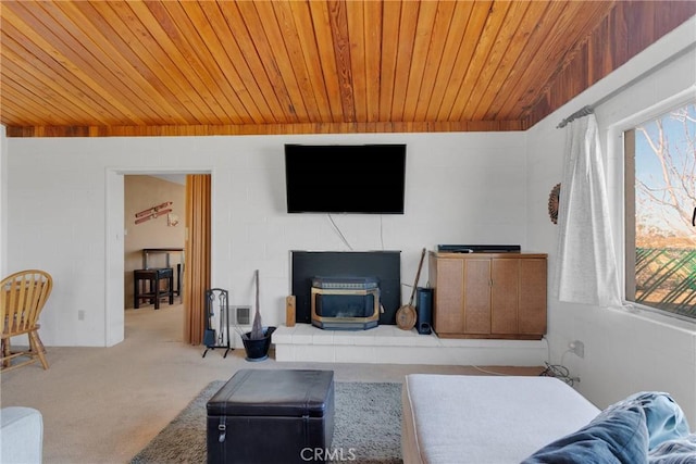 living room featuring wood ceiling, carpet, lofted ceiling, and a wealth of natural light