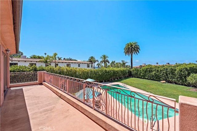 view of pool featuring a patio area, a lawn, and a fenced in pool