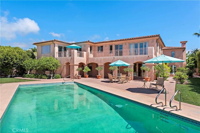 pool featuring a patio area