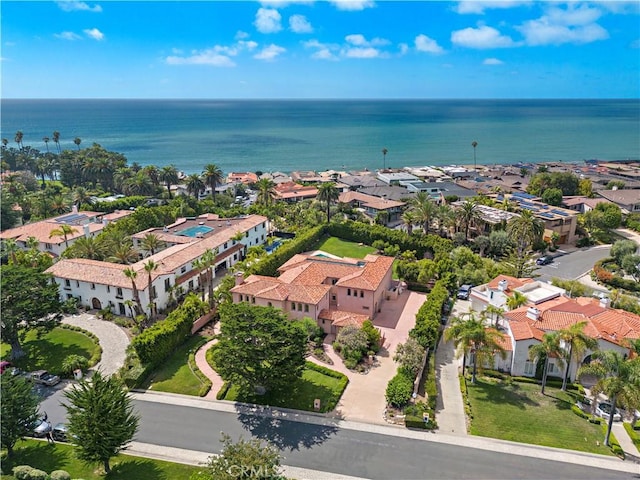 drone / aerial view featuring a water view and a residential view