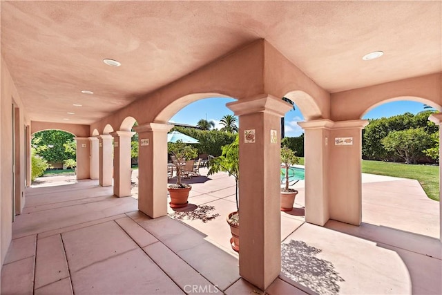 view of patio / terrace featuring outdoor dining area and an outdoor pool