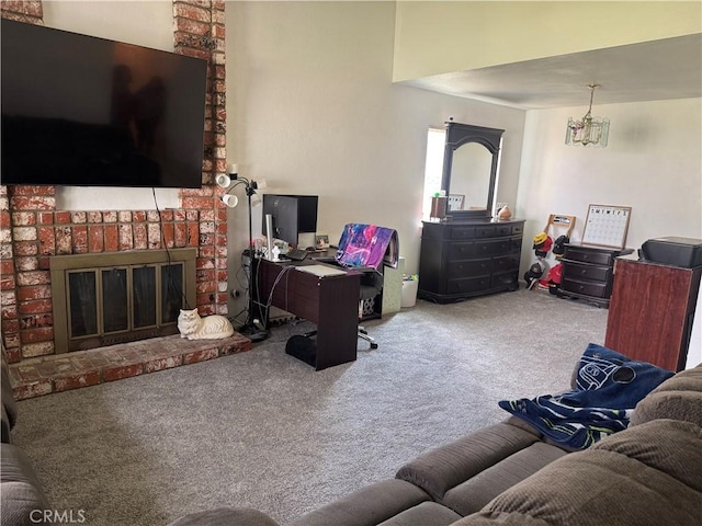 living area with a fireplace and carpet flooring