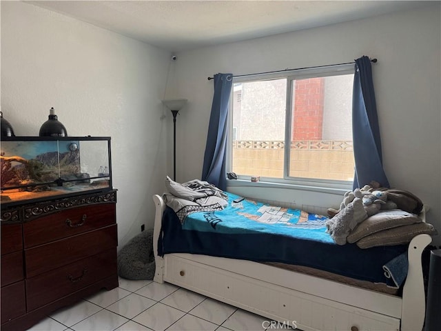 bedroom featuring light tile patterned floors